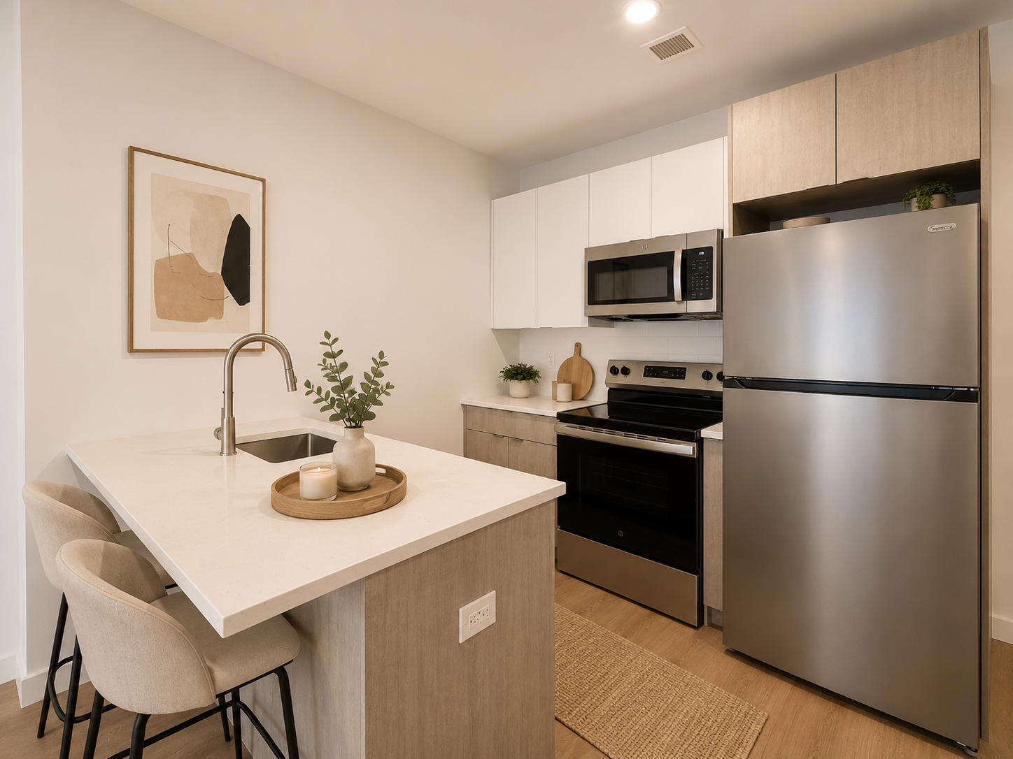 Kitchen at Darome with island seating and stainless appliances